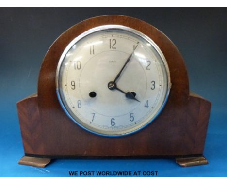 An Enfield two train mantel clock with key, instructions and original receipt from Wheelers Jewellers 