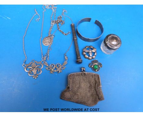 A glass dressing table pot with hallmarked silver lid, silver necklaces, hallmarked silver bangle, white metal purse marked 9