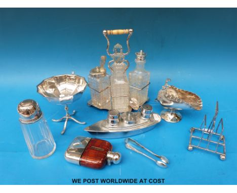 A collection of plated items to include a four division cruet, Art Deco toast rack, flask etc