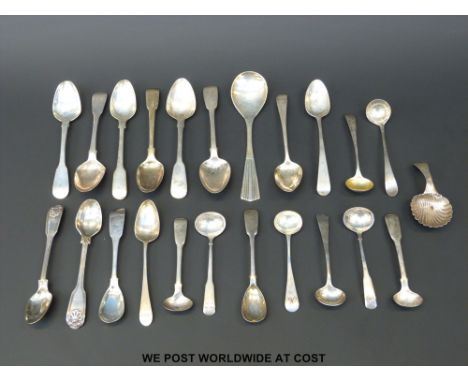 A quantity of Georgian hallmarked silver cutlery including fiddle thread and shell mustard spoons, caddy spoon etc, some Newc