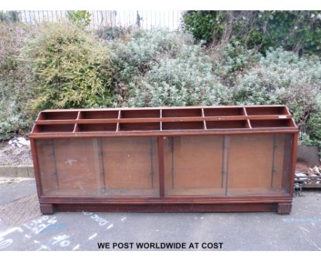 An impressive late 19th / 20thC mahogany haberdashery or shopfitting counter / cabinet previously in a cobbler's. The shaped 