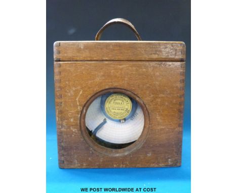 An oak cased racing pigeon clock with Toulet label to front