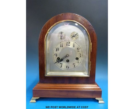 A large Junghans Wurtenberg three train mantel clock, the Westminster chime striking on five bars, in arch top mahogany case,