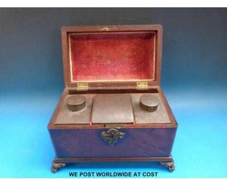A 19thC mahogany tea caddy raised on brass claw feet, length 28cm  