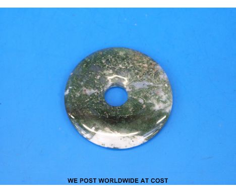 A Chinese spinach jade bi-disc (4.5cm in diameter)