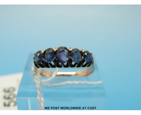 A 9ct gold ring set with five oval cut graduated sapphires, size J/K (2.2g)