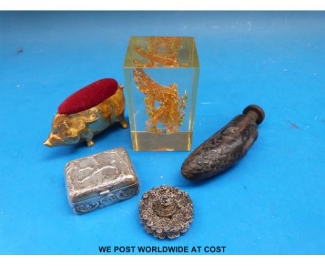 A continental white metal pill box with embossed decoration of a man playing golf stamped 925 sterling together with a white 