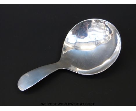 A hallmarked silver George III caddy spoon, London 1802, maker's mark rubbed, length 8.5cm 