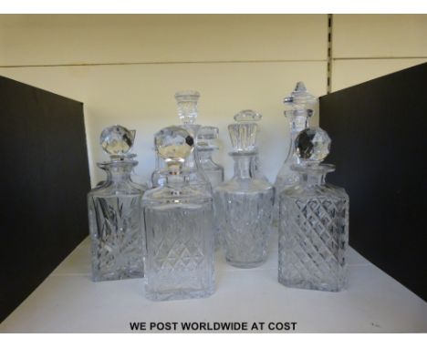 Ten cut glass decanters of various shapes and sizes by makers including Thomas Webb 