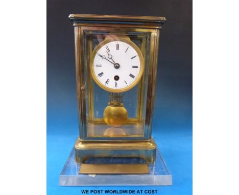 A large brass carriage clock in a conical style case, overall height 28cm  with presentation plaque 'To Paul from his friends