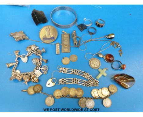 A quantity of silver jewellery to include a bangle, Gloucestershire Royal Infirmary brooch, silver charm bracelet, silver coi
