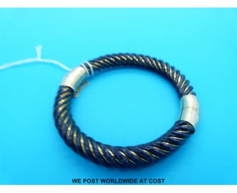 A turned lapis lazuli bangle with gold banding and 14ct gold clasp