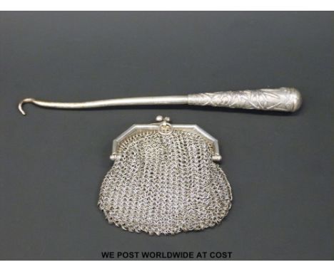 A Chinese white metal button hook and a silver mesh purse, weight of both 66g 