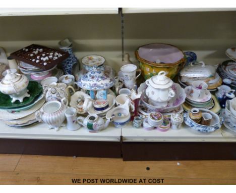 A collection of ceramics to include jugs, plates and ceramic candle sticks.