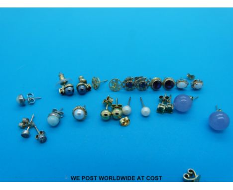 A collection of gold earrings including opal, sapphire, emerald, pearl and diamond studs etc, some marked 9ct gold 