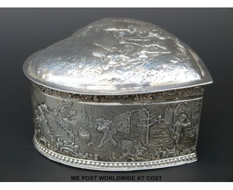 A Victorian hallmarked silver heart shaped trinket box, width 11cm, with fine embossed farming scenes to top and sides, impor