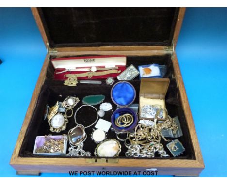 A collection of jewellery to include cameo brooches, agate brooch, watch keys, Jubilee match box, Royal Army Ordnance Corps b