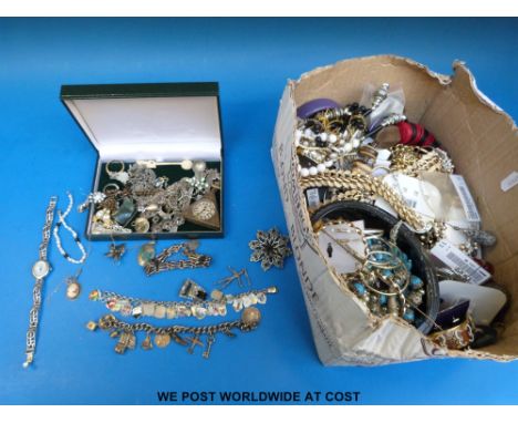 A white metal bracelet with a large quantity of enamel shields, a 9ct gold charm, silver items including charm bracelet with 