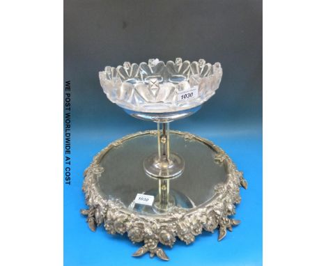 A plated mirrored cake stand together with a glass and silver plated centrepiece.  