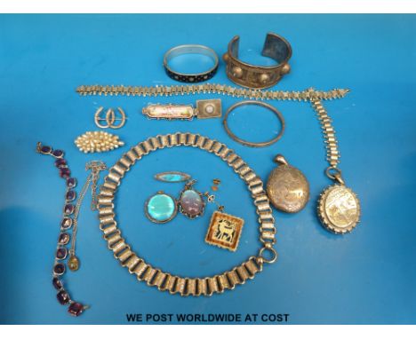 Two silver lockets, a white metal necklace, silver bangle, two white metal pendants and a brooch, all set with butterfly wing