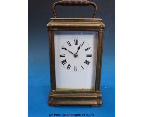 A brass cased carriage clock in gorge style case striking on a gong 