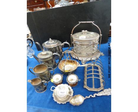 A plated and cut glass biscuit barrel, plated tea set, toast racks, unusual salts in the form of pails, white metal Indian sp