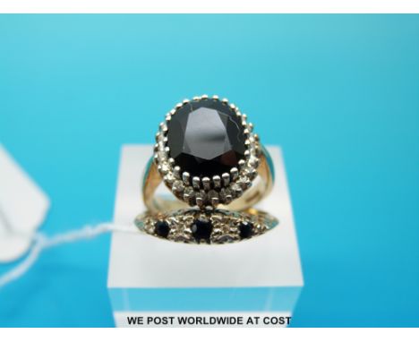 A 9ct gold ring set with a sapphire and diamonds and a 9ct gold ring set with sapphires and diamonds, size R & N (7.8g)