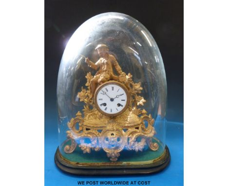A French gilt/ormolu figural mantel clock on a plush base under a glass dome 