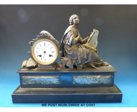 A marble and spelter figural mantel clock with two train movement