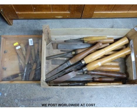 A quantity of various wood turning or carving tools
