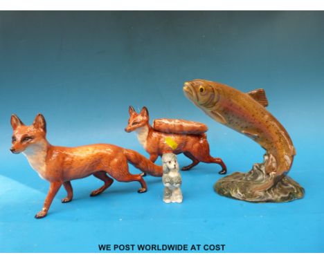 A Beswick trout, two Beswick foxes & a Wade figure 