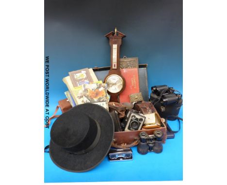 A leather case containing cut throat razors, cigarette and tea cards, binoculars, cameras, barometer, stamps and coins etc