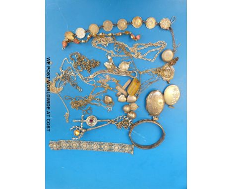 A collection of silver jewellery to include lockets, bangle, necklaces etc 