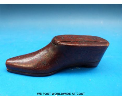 A treen snuff box in the form of a clog dated 1864, length 9.5cm 