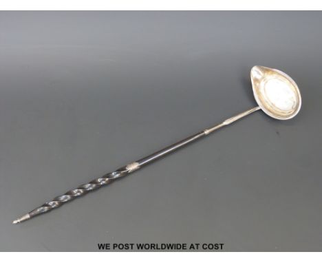 A Georgian hallmarked silver whale bone handled toddy ladle, London 1808 maker Thomas Wallis, (length 43cm)