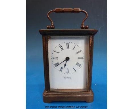 A brass cased carriage clock signed Rowell Oxford to the dial, complete with key and leather case