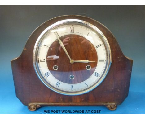 A Smiths three train mantel clock with  Westminster chime, together with a carved banjo style barometer.