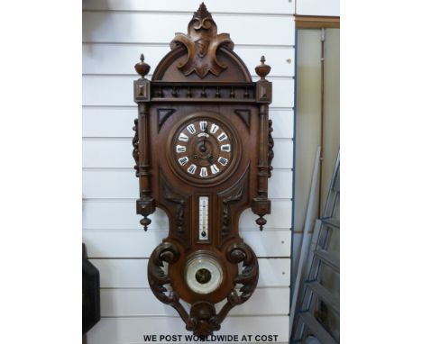 A large carved continental wall clock, and barometer compendium, Jourdan Brest to dial, with inset enamel numerals