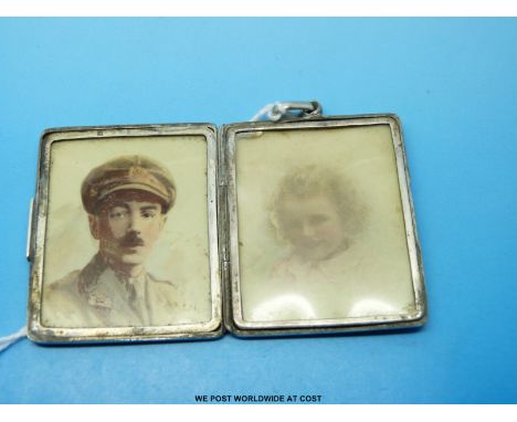 A hallmarked silver locket / photgraph frame with two portrait miniatures, one of a soldier 