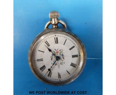 A hallmarked silver pocket watch holder in the form of a carriage clock with a silver fob watch having chased decoration 