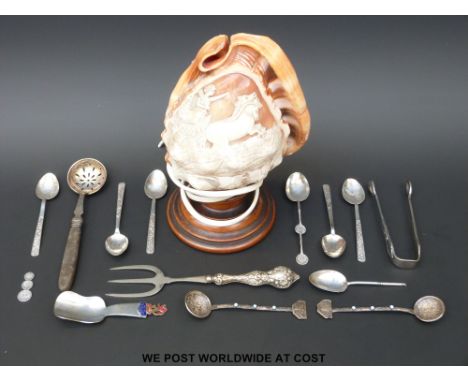 Five oriental white metal spoons, hallmarked silver handled fork, Scottish 1938 exhibition caddy spoon and a carved cameo con