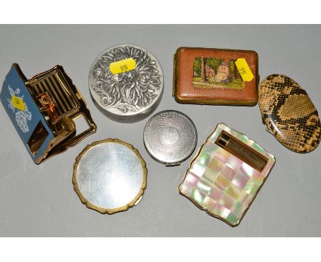 SIX COMPACTS AND A POWDER CASE, to include Stratton compacts with integral lipstick holders, one with mother of pearl casing,