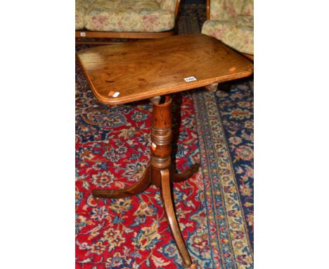 A GEORGE III RECTANGULAR CHERRYWOOD AND OAK TILT TOP TRIPOD TABLE, turned pedestal to splayed legs with flattened bun feet, w