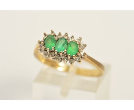 A MODERN 9CT GOLD EMERALD AND DIAMOND DRESS RING, approximate diamond weight 0.15ct, ring size O 1/2, approximate gross weigh