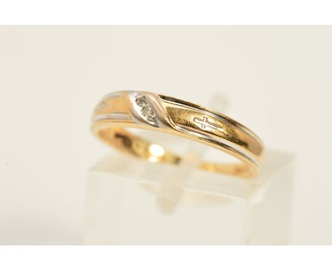 A DIAMOND SET RINGS, designed with an angular line of two single cut diamonds and engraved cross detail to either side, stamp