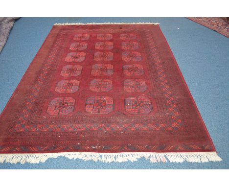 A LATE 20TH CENTURY TEKKE STYLE RED GROUND CARPET SQUARE, 295cm x 201cm (low pile)