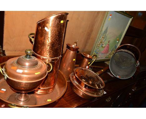 A COLLECTION OF VARIOUS COPPER to include a twin handled pan, coal scuttle, two hay stack measures, etc and a fire screen (10