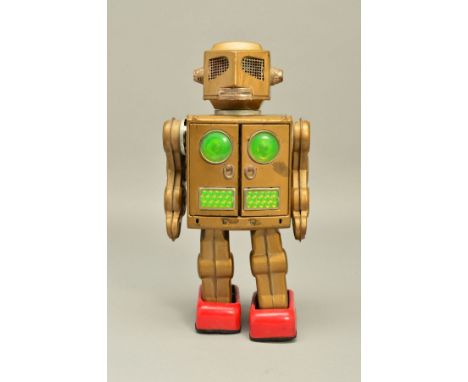 AN UNBOXED SH HORIKAWA TINPLATE BATTERY OPERATED ATTACKING MARTIAN ROBOT, all metal version with gold body, not tested, appea