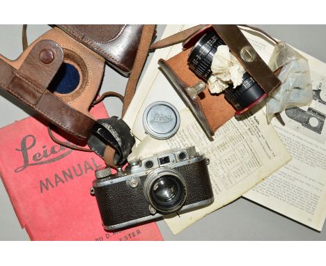 A LEICA IIIB FILM CAMERA, in its original leather case and fitted with a Summitar 5cm f2 lens with two lens hoods, a Samoca L