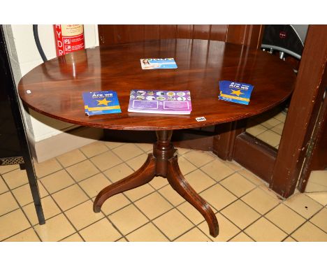 A 19TH CENTURY WALNUT OVAL BREAKFAST TABLE, reeded edge, tilt top on a turned pedestal with reeded tripod legs, oval 115cm x 